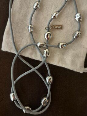 "TWO" Single Strand long necklace.   Worn only once.  Silver colored